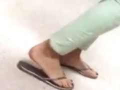 Candid feet painted toes in Flip Flops