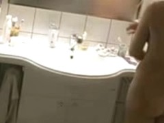 Spying MILF in the bathroom