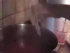 Blonde girl prepares a dessert with her big boobs naked