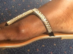 Ultra Close-Up of Beautiful Ebony Feet on the Train