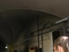 A fit brunette enjoys a smoothie and broods