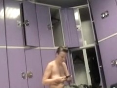 Naked female is sitting on the changing room bench