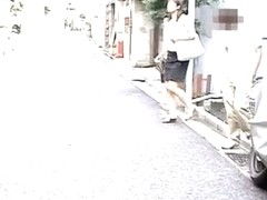 Sexy Asian girl runs for cover in a Japanese sharking video