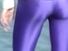 Candid amateur in lilac pantyhose walking along the quay 03zm