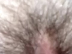 Playing with her hirsute pussy by fingering it and tongue fucking