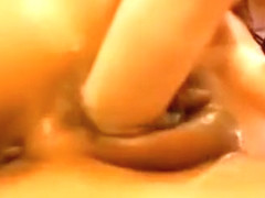 Brunette moaning while masturbating