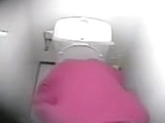 The hidden camera shoots masturbation of Asian in toilet