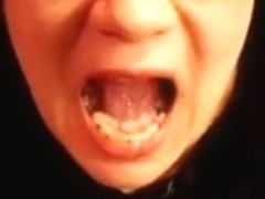 Taking a load of cum in her throat and playing with it