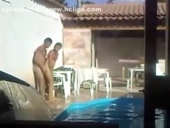 Voyeur tapes a latin couple having sex on the side of the pool