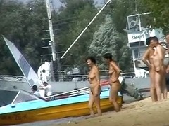 Hot beach voyeur video shows mature nudists enjoying each others company.