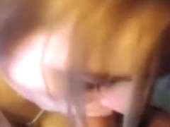 Cute ponytailed girl pleasures her bf orally on a chair