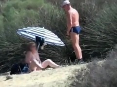 Voyeur tapes 2 dudes jerking off, while watching a gilf in the hills.