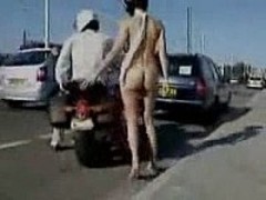 Naked on a motorcycle