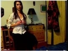 Beautiful brunette stripping and pleasuring herself