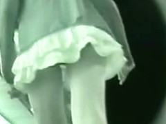 A night video of a girl in white skirt walking with her boy