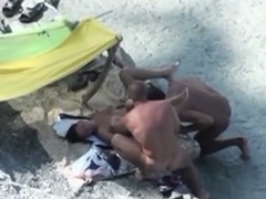 Pair lascivious on the beach caught fucking in 3some on hidden voyeur camera